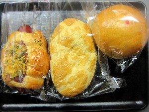 chicken bun, spicy sausage roll, and pineapple bread from UCafe