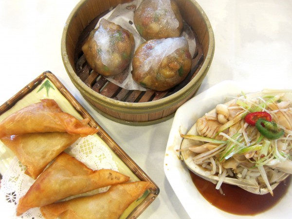 Clockwise from top: Chiu Zhou dumpling ($3.95), steamed clam ($6.95), curry chicken samosas ($3.25)