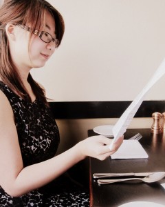 Kristen studying Corso menu. 