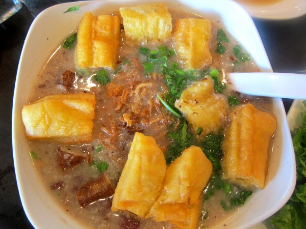 Chao long - rice porridge with "dau chao quay" (youtiao) and pork offals.  