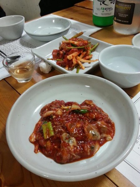 I didn't get a chance to ask about a lot of the food, so unfortunately I can't identify everything accurate. The foreground was some type of seafood - oysters maybe? The background is a kimchi!